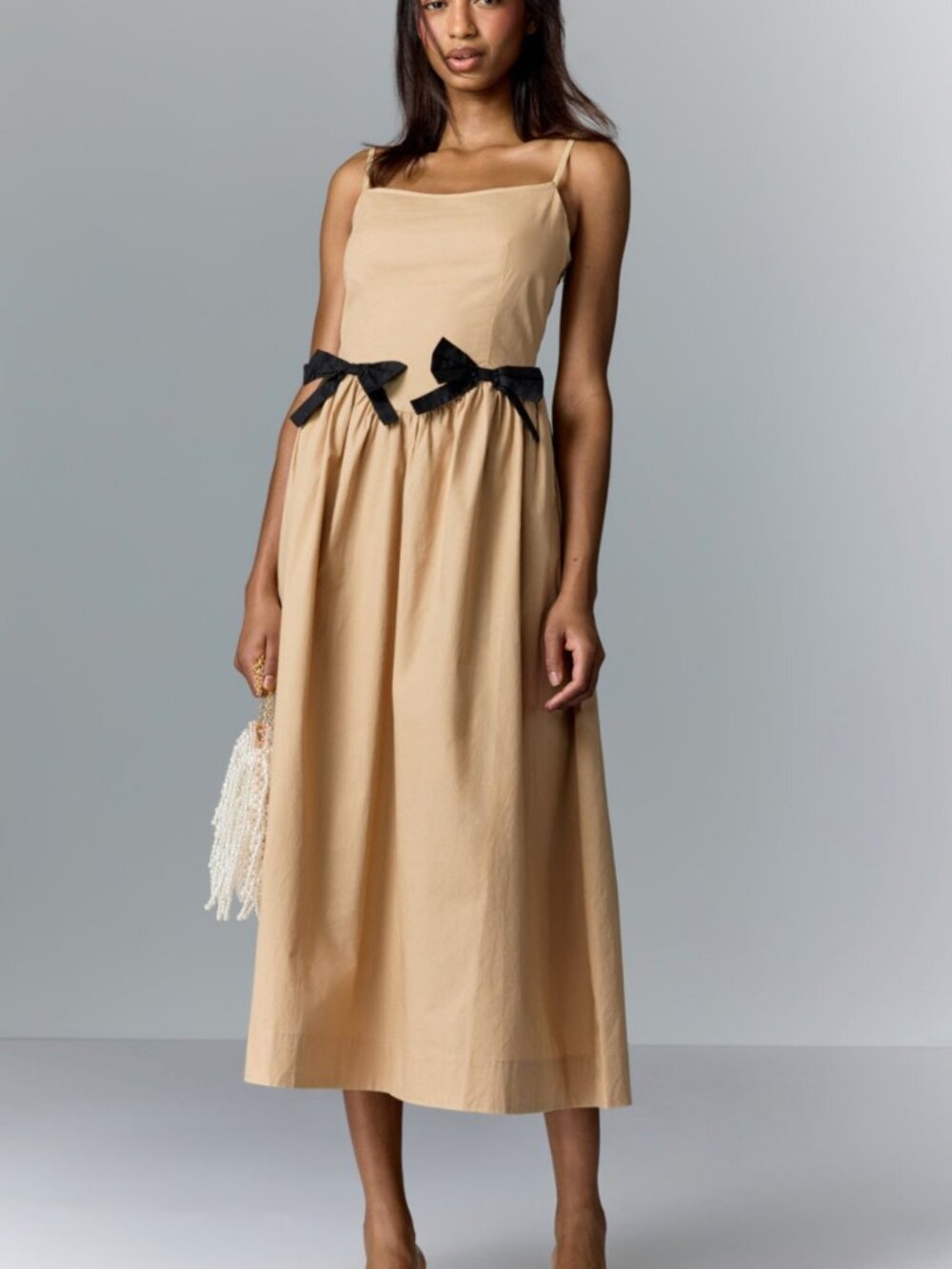 Moon River Beige Midi Dress with Black Bow Accents